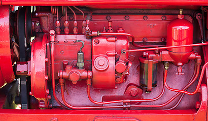 Image showing Red engine on old tractor