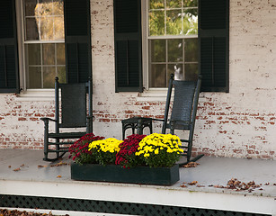 Image showing Old rocking chairs on porch