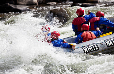 Image showing Group in out of control white water raft