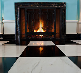 Image showing Old fireplace with logs