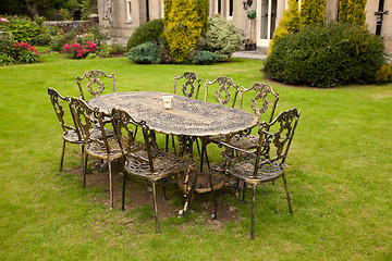 Image showing Cast iron table and chairs