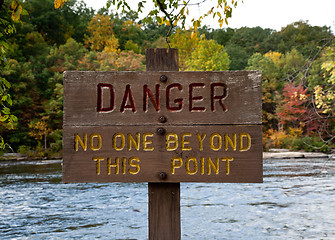 Image showing Danger sign by river