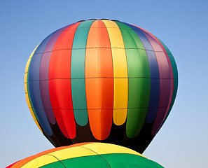 Image showing Multicolored Hot air balloon rising over another