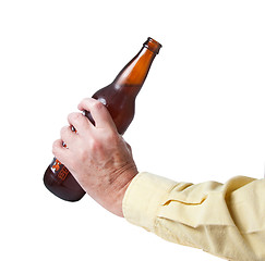 Image showing Brown bottle of beer in old hand