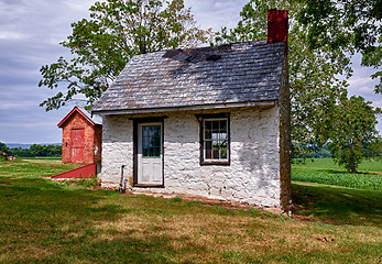 Image showing Old white house on farmland