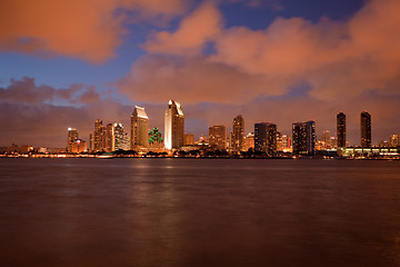 Image showing Orange clouds reflect light from San Diego Skyline