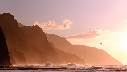 Image showing Sunset off the Na Pali coastline on Kauai with a stormy sea