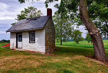 Image showing Old white house on farmland