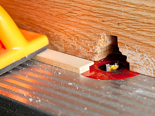 Image showing Router blade cutting rebate in strip of wood