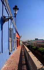Image showing Brightly painted houses on old pathway