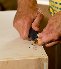 Image showing Sharpen a pencil with blade