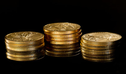 Image showing Macro image of gold eagle coin on stack