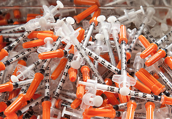 Image showing Close-up of used hypodermic syringes