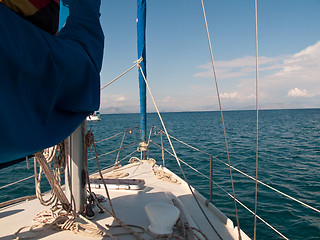 Image showing White yacht sailing on calm sea