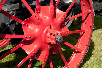 Image showing Old red farm wheel