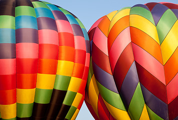 Image showing Two Hot air balloons bumping