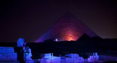 Image showing Colored lights illuminate Sphinx and Pyramids