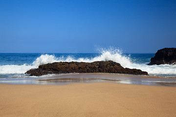 Image showing Waves over rocks on Lumahai