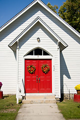 Image showing Close up of red church doors