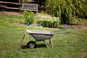 Image showing Wheelbarrow and spade