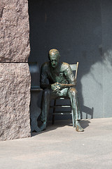 Image showing Statue of poor man listening to radio