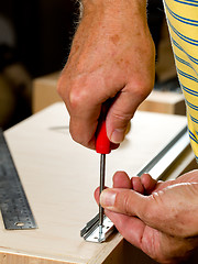 Image showing Woodwork tools working on piece of plywood