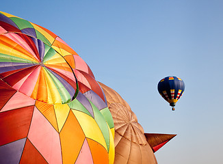 Image showing Hot air balloon in the air above two others