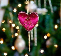 Image showing Red velvet heart in front of xmas tree