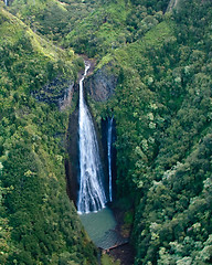 Image showing Aerial view of waterfall in mountains of Kauai