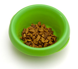 Image showing Green pet bowl with biscuits