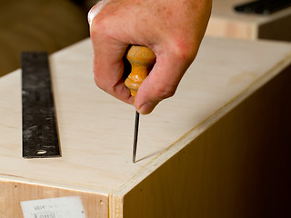 Image showing Woodwork tools working on piece of plywood