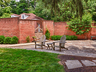 Image showing Cape cod chairs on stone patio