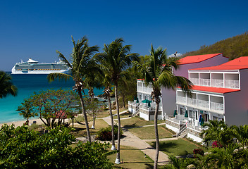 Image showing Cruise ship sails by vacation resort
