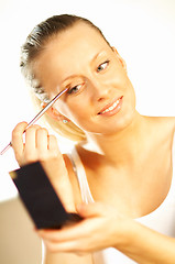 Image showing Girl doing makeup