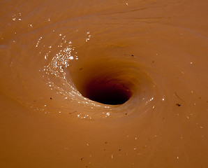 Image showing Flood water swirling in whirlpool pattern