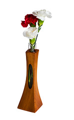 Image showing Red and white spray carnations in teak vase