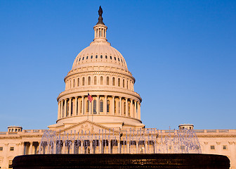 Image showing Rising sun illuminates the front of the Capitol building in DC