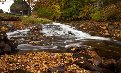 Image showing Water rushing down river