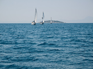 Image showing Three yachts in ocean