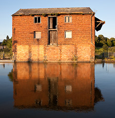 Image showing Reflection of red brick warehouse in Ellesmere Canal