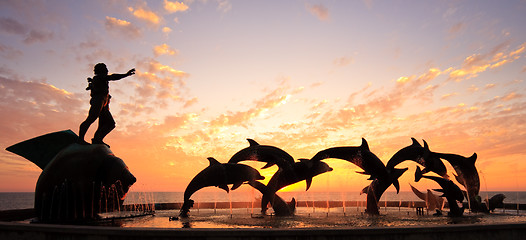 Image showing Sunset with statue of Dolphins and Fisherman in Mazatlan