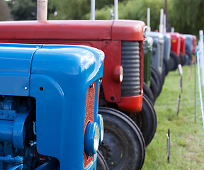 Image showing Row of old tractors