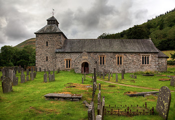 Image showing Cloudy sky overshadows Melangell Church in Wales