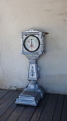 Image showing Old weigh scale against white wall