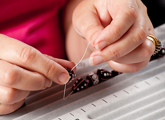 Image showing Making bead necklace