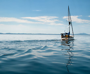 Image showing White yacht sailing on calm sea