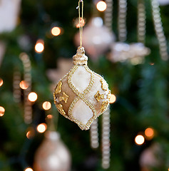 Image showing Ornate decoration in front of Christmas tree