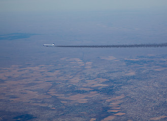 Image showing Airliner with long smoke plume