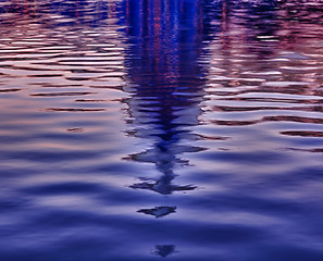 Image showing Sunrise behind the dome of the Capitol reflected in water