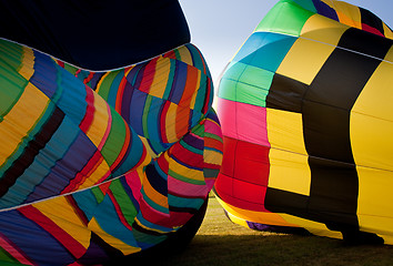 Image showing Two Hot air balloons being inflated